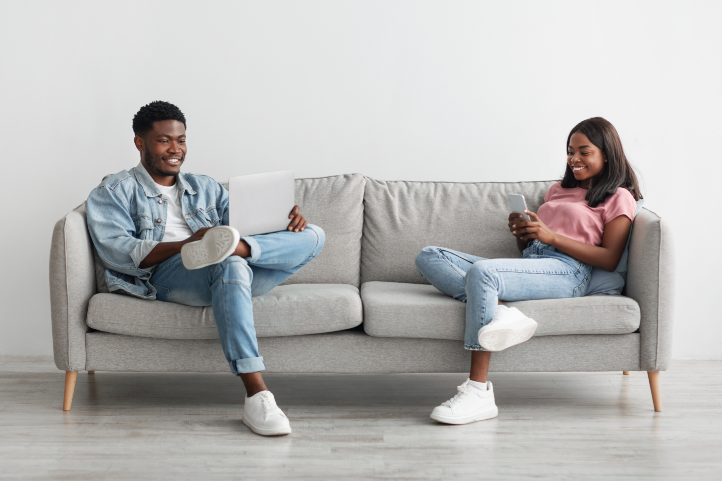 people sitting on a couch and smiling